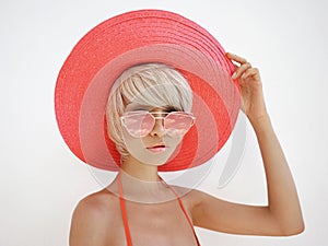 Beautiful lady in red hat and sunglasses