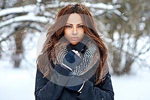 Outdoor fashion portrait of a beautiful elegant woman in winter - close up
