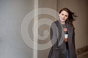 Outdoor fashion portrait of beautiful fashionable girl posing in street, Copy, empty space