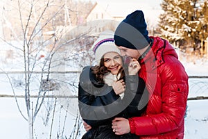 Outdoor fashion portrait of young sensual couple in cold winter wather.