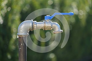 An outdoor faucet in the garden