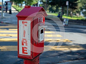 Outdoor fire alarm call box at urban intersection