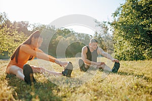 Outdoor Fitness Determined Man and Woman Training Together