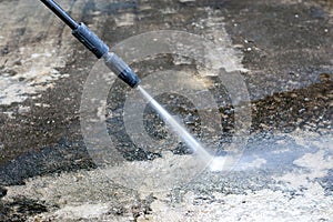 Outdoor floor cleaning with high pressure water jet.