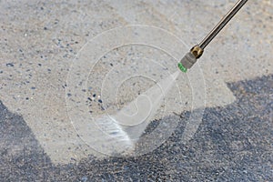 Outdoor floor cleaning with high pressure water jet