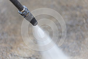 Outdoor floor cleaning with high pressure water jet