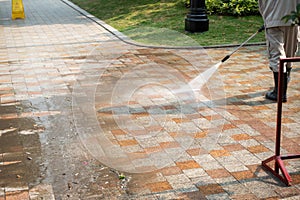 Outdoor floor cleaning with a pressure water jet on street