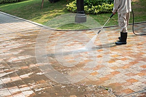 Outdoor floor cleaning with a pressure water jet on street