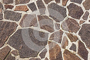 Outdoor flooring made with irregular porphyry slabs - Italy