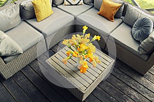 Outdoor furniture lounge group with chairs, sofa and table in a patio. Seating on the balcony, is a recreation place
