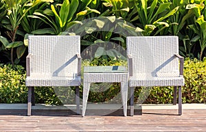 Outdoor furniture rattan armchairs and table on terrace