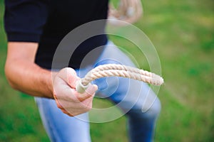 Outdoor games - guy playing ring toss in a park.