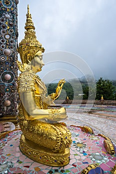 Outdoor Golden Buddha Image in beautiful Buddhist temple