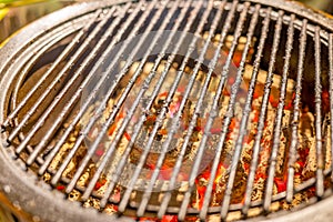 Outdoor grill with hot charcoal, ready for food