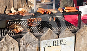 Outdoor grill with ribs and sausages photo