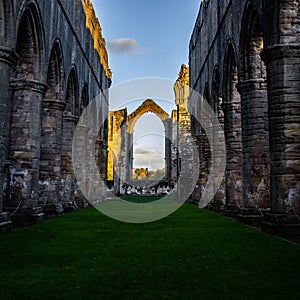 Outdoor hallway at the ruins of Fountains Abbey in Ripon, North Yorkshire, UK