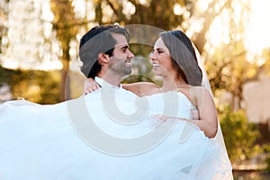 Outdoor, happy couple and celebration in wedding day with commitment, love and trust of bride and groom. Marriage, man