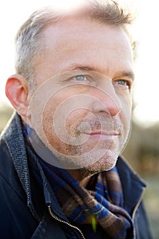 Outdoor Head And Shoulders Portrait Of Mature Man