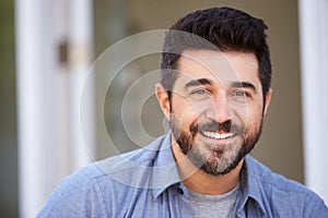 Outdoor Head And Shoulders Portrait Of Smiling Mature Man