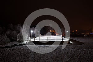 Outdoor hockey rink at night