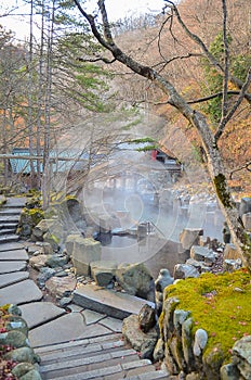 Outdoor hot spring with stone walk path, Onsen in japan