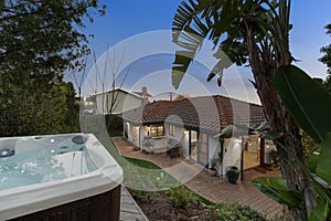 Outdoor hot tub in the backyard of a suburban house