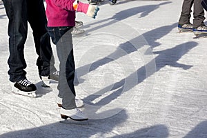 Outdoor Ice Skaters and Shadows