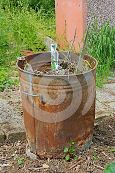 Outdoor incinerator full of garden rubbish