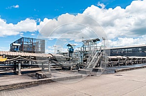 Outdoor incline large conveyor with rubber belt conveyor for transportation line for processing the coal in the coal mine.