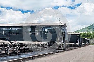 Outdoor incline large conveyor with rubber belt conveyor for transportation line for processing the coal in the coal mine.