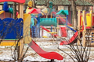 Outdoor kids playground in winter city