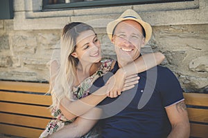 Outdoor lifestyle portrait of young couple in love in old town