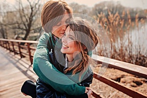 Outdoor lifestyle portrait of young happy couple