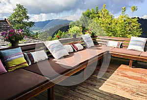 Outdoor living room or balcony with pillows