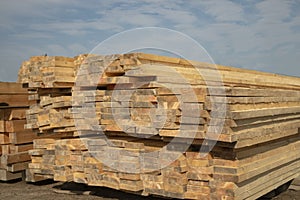 Outdoor lumber warehouse. A stack of 50mm dry board