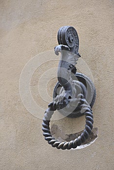 Outdoor old horse hitching ring on a historical wall