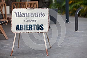 Outdoor open sign in Spanish photo