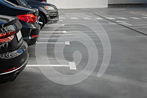 Outdoor parking lot with cars on sunny day