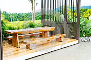 Outdoor patio deck and chair with mountain hill background