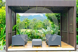 Outdoor patio deck and chair with mountain hill background