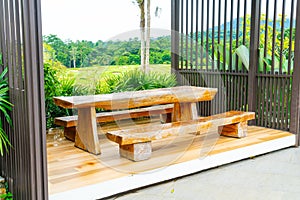 Outdoor patio deck and chair with mountain hill background