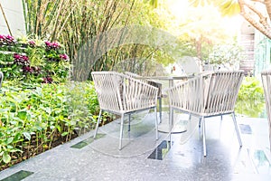 Outdoor patio with empty chair and table