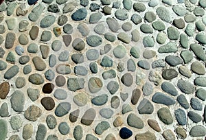 Outdoor pebble floor, massage stone walkway texture concrete wall brown floor old background decorative small stone texture