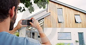 Outdoor, phone and photography of house, sale for review and pictures with mobile app. Person, choice and real estate