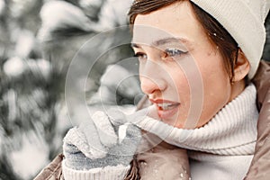 Outdoor photo of cozy female in winter forest