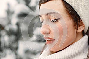 Outdoor photo of cozy female in winter forest