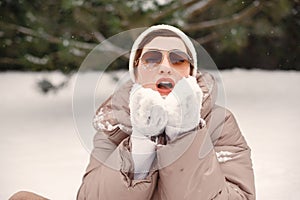 Outdoor photo of cozy female in winter forest