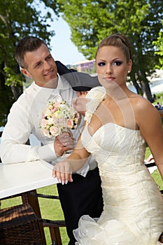 Outdoor photo of young couple on wedding-day