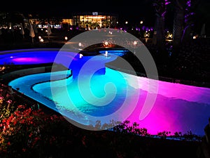 Outdoor pools thermal colorful lighted in the night