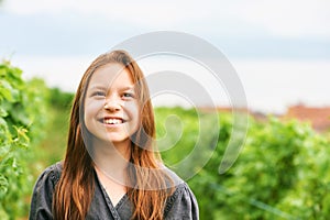 Outdoor portrait of adorable kid girl